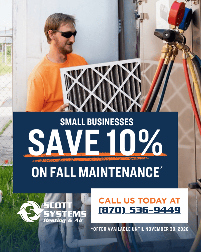 A technician services an HVAC unit during our fall promo. Small businesses save 10% on maintenance by calling (870) 536-9449 before November 30, 2026.